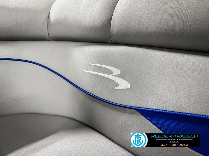 Slide: The Image of 2023 Bennington 208 SL boat interior with gray and blue upholstery. - 41
