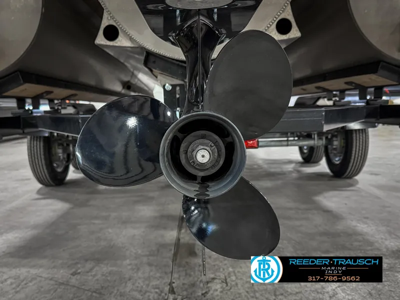 Slide: The Image of Propeller of 2023 Bennington 208 SL boat on trailer, Reeder-Trausch Marine logo visible. - 47