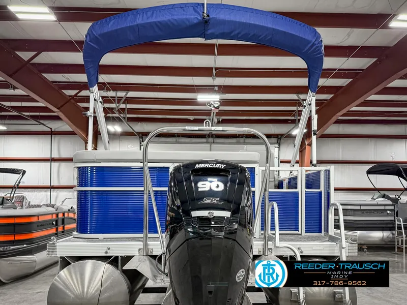 Slide: The Image of 2023 Bennington 208 SL pontoon boat with Mercury 90 engine in showroom. - 9