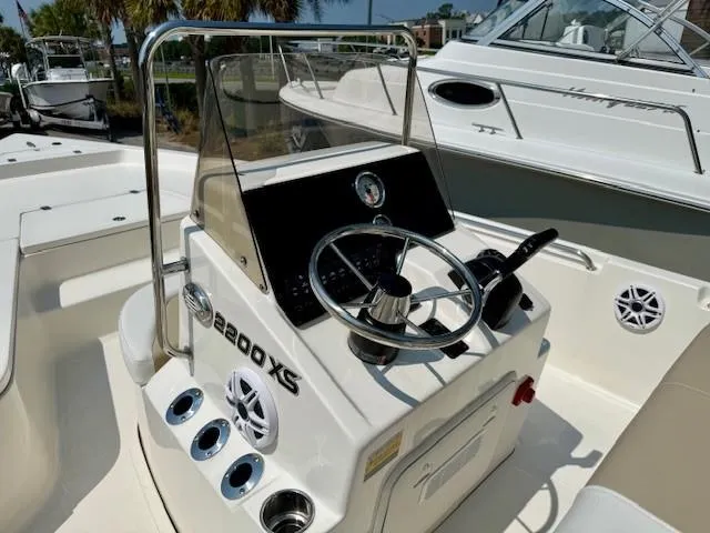 Slide: The Image of 2025 Bulls Bay 2200 XS boat console with steering wheel and controls. - 4