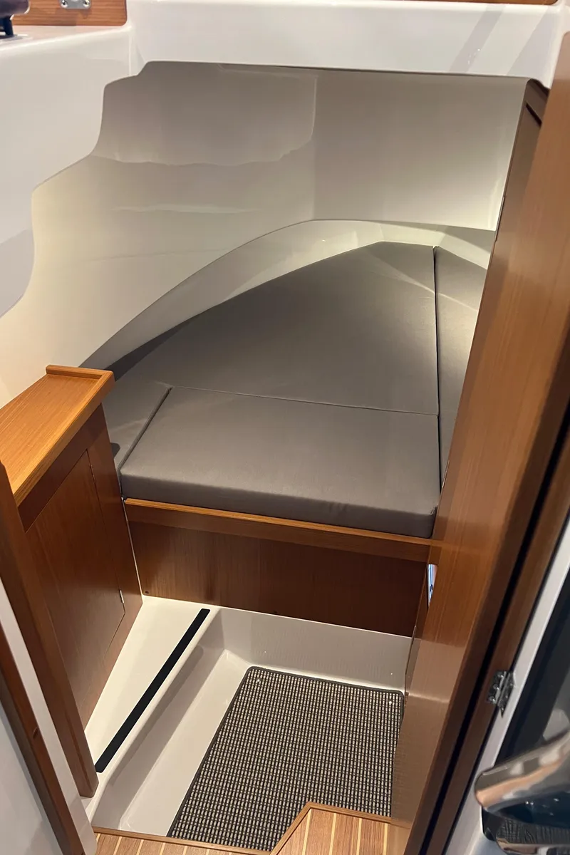 Slide: The Image of 2025 Sargo All Season boat interior cabin with sleek design and comfortable seating. - 10