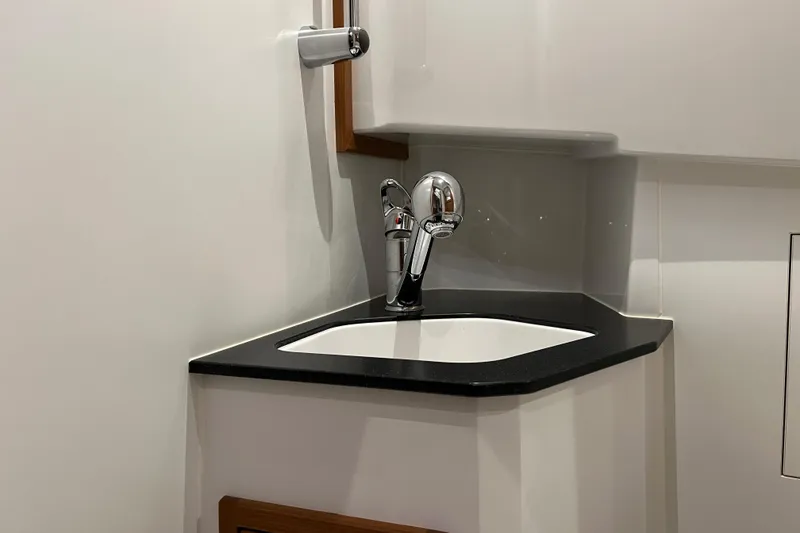 Slide: The Image of Compact sink area in 2025 Sargo All Season boat interior. - 15