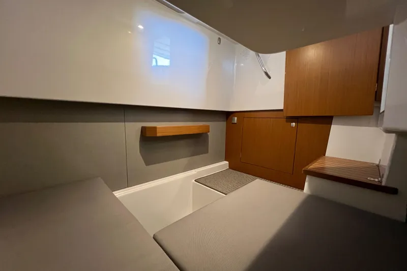 Slide: The Image of Interior cabin of 2025 Sargo All Season boat, featuring modern design and wood accents. - 19