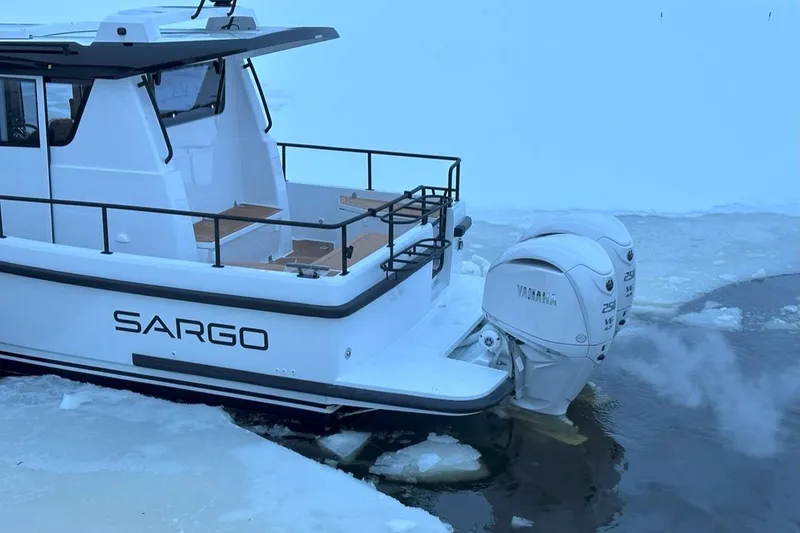 Slide: The Image of 2025 Sargo All Season boat navigating icy waters with Yamaha outboard motor. - 3