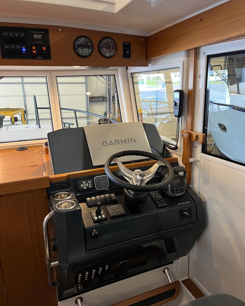 Slide: The Image of 2025 Sargo All Season boat cockpit with Garmin navigation system and modern controls. - 6