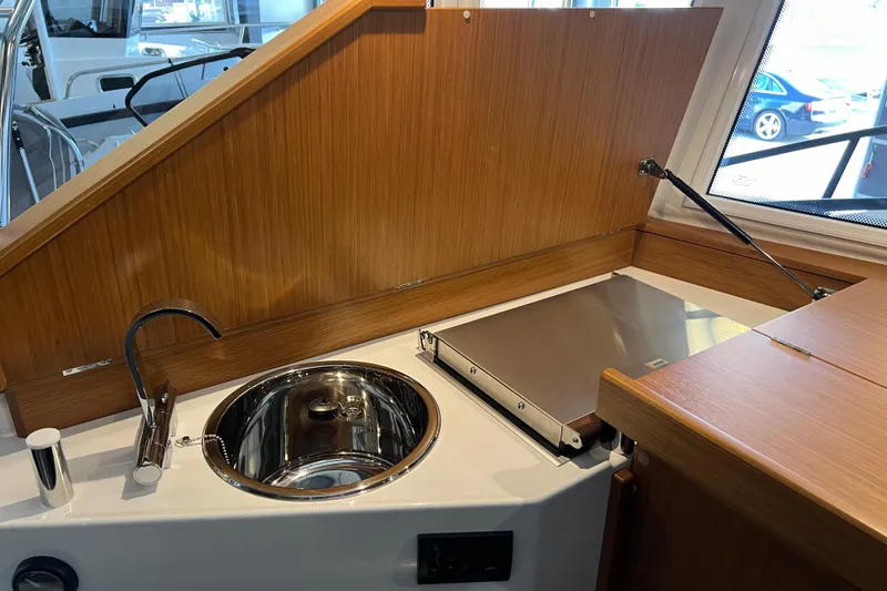 Slide: The Image of Compact kitchen area in 2025 Sargo All Season boat with sink and stove. - 7