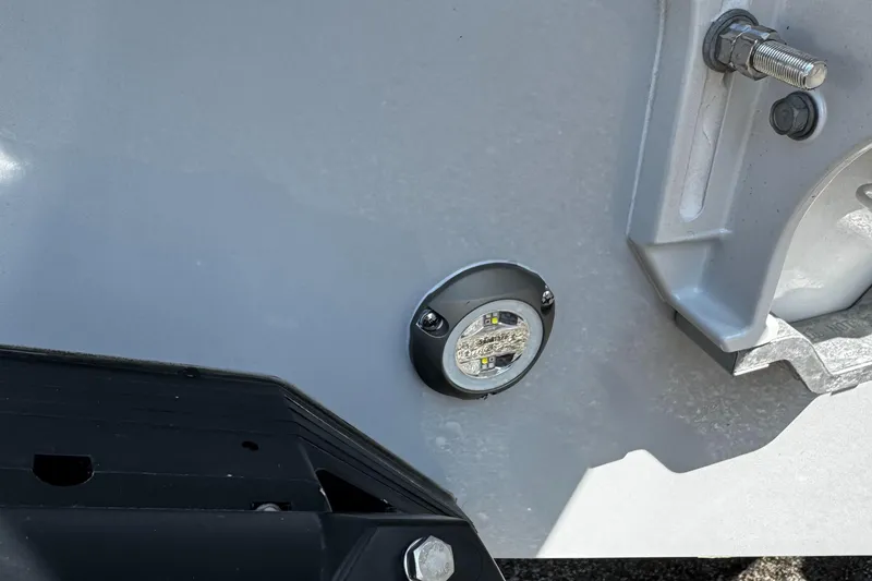 Slide: The Image of Close-up of 2025 Tidewater 282 CC Adventure boat's hull detail with mounted hardware. - 15