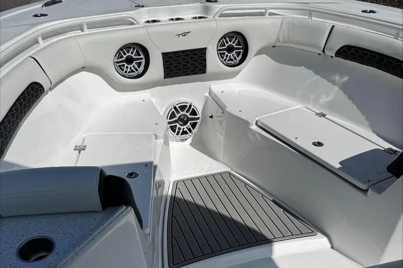 Slide: The Image of 2025 Tidewater 282 CC Adventure boat interior with seating and speakers. - 19