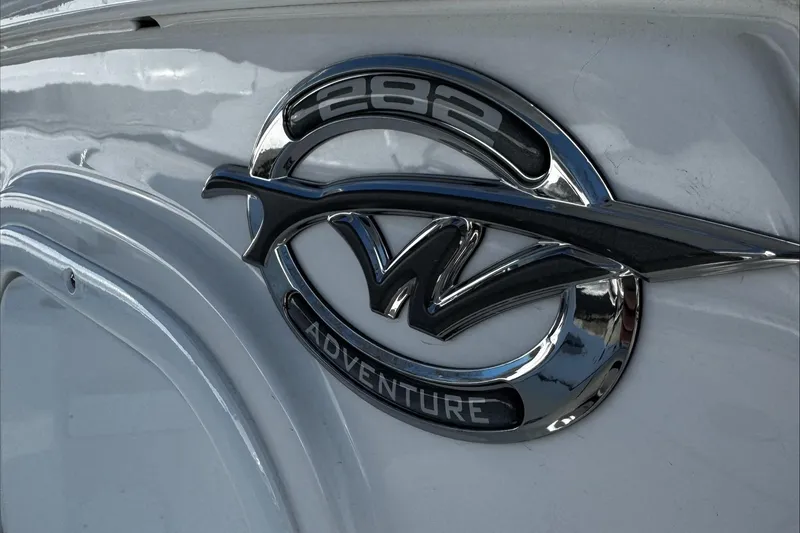 Slide: The Image of 2025 Tidewater 282 CC Adventure logo on boat exterior. - 21