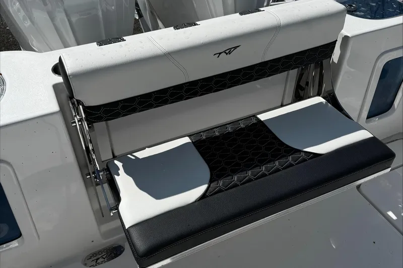 Slide: The Image of 2025 Tidewater 282 CC Adventure boat seat with black and white upholstery. - 26