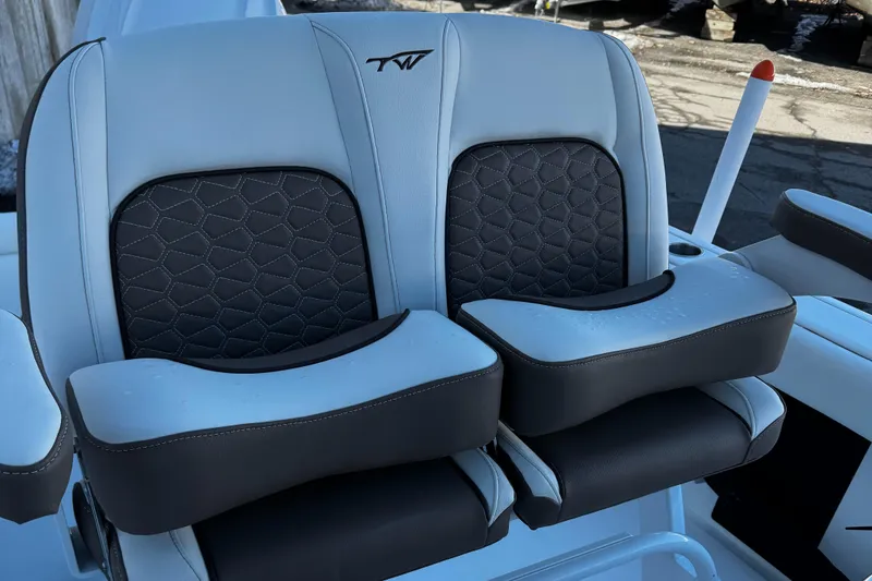 Slide: The Image of 2025 Tidewater 232 LXF boat seats with black and gray upholstery. - 12