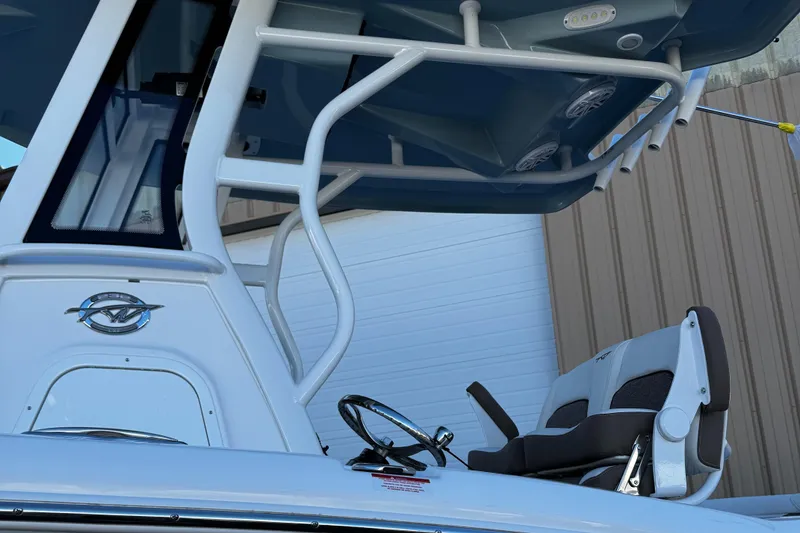 Slide: The Image of 2025 Tidewater 232 LXF boat, featuring sleek design and modern seating. - 16