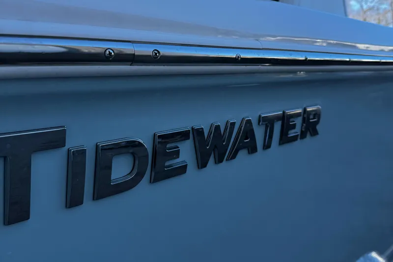 Slide: The Image of 2025 Tidewater 232 LXF boat logo on blue hull. - 5