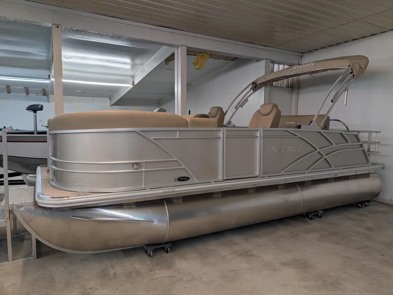 The Image of 2025 Sylvan Mirage Cruise 8520 CLZ DH pontoon boat in a showroom. - 0