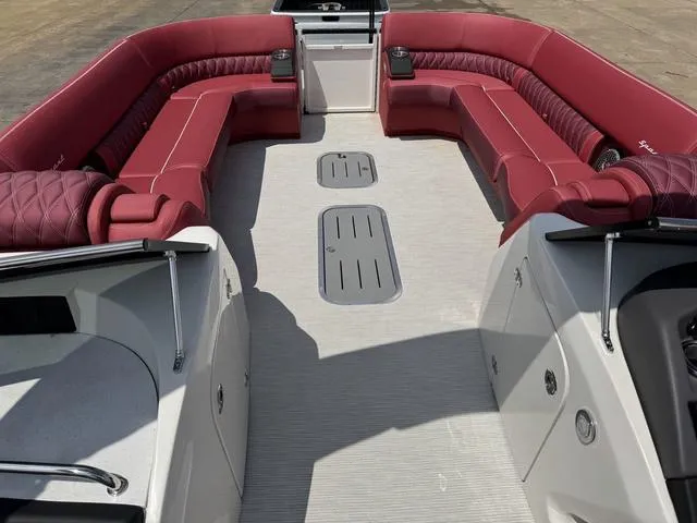 Slide: The Image of Red leather seating with speaker detail in 2025 Bennington QX Swingback 30 QXSBWAX2. - 15