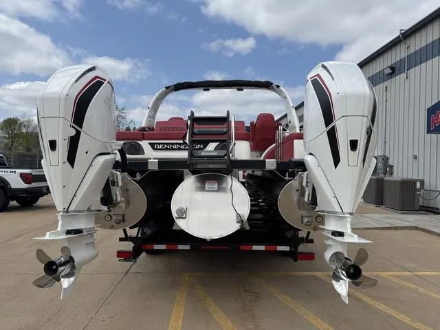 Slide: The Image of 2025 Bennington QX Swingback 30 QXSBWAX2 pontoon boat docked on a sunny day. - 3