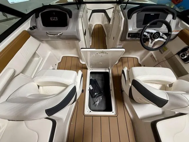Slide: The Image of 2025 Chaparral 23 SSi boat interior with seating and storage compartment. - 10
