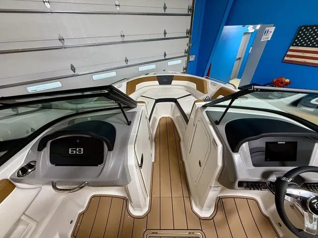 Slide: The Image of 2025 Chaparral 23 SSi boat interior with modern dashboard and seating. - 13
