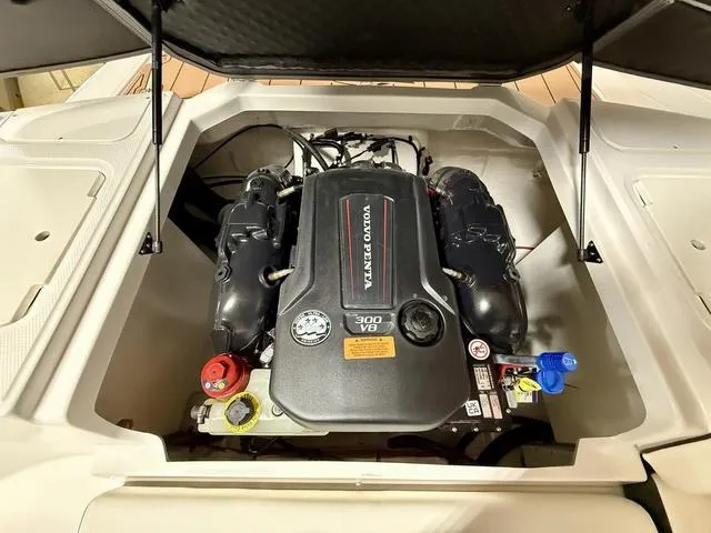 Slide: The Image of 2025 Chaparral 23 SSi boat engine compartment with Volvo Penta 300 V8 engine. - 17