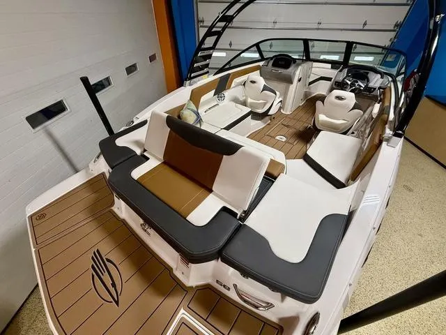Slide: The Image of 2025 Chaparral 23 SSi boat interior with sleek seating and modern design. - 18