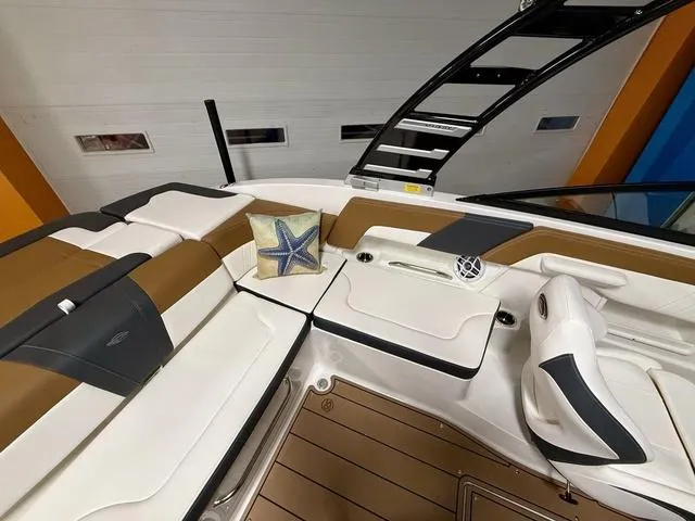 Slide: The Image of Interior of 2025 Chaparral 23 SSi boat with cushioned seating and starfish pillow. - 6