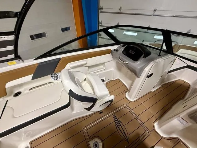 Slide: The Image of 2025 Chaparral 23 SSi boat interior with modern dashboard and seating. - 9