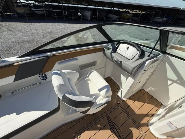 Slide: The Image of 2025 Chaparral 23 SSi boat interior with modern seating and dashboard design. - 14