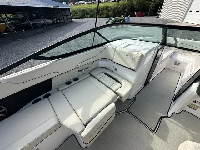 Slide: The Image of 2022 Regal 22 FasDeck boat interior with white seating and sleek design. - 12