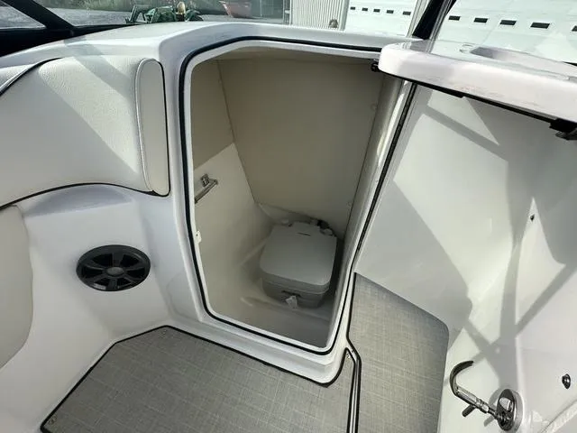 Slide: The Image of 2022 Regal 22 FasDeck boat interior with compact toilet compartment. - 13
