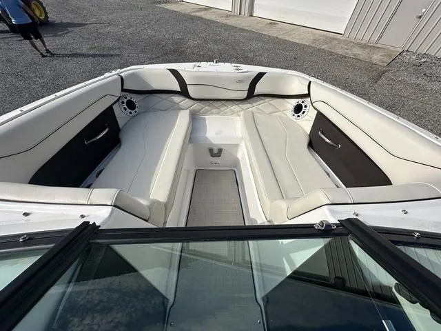 Slide: The Image of 2022 Regal 22 FasDeck boat interior with white seating and modern design. - 14