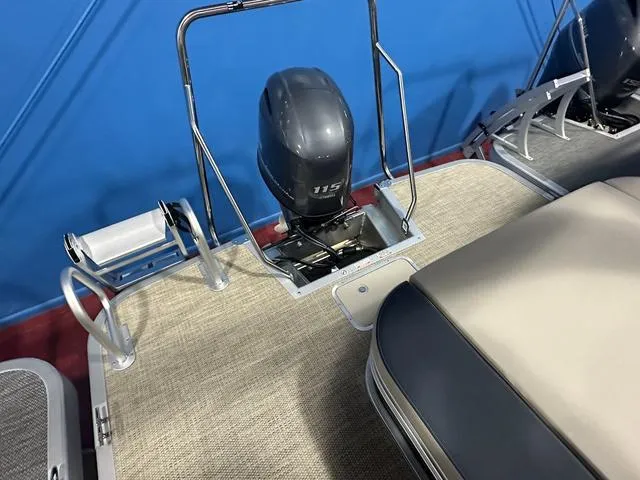 Slide: The Image of 2024 Bennington 22' SSB boat with 115 horsepower engine, beige seating, and carpeted deck. - 10