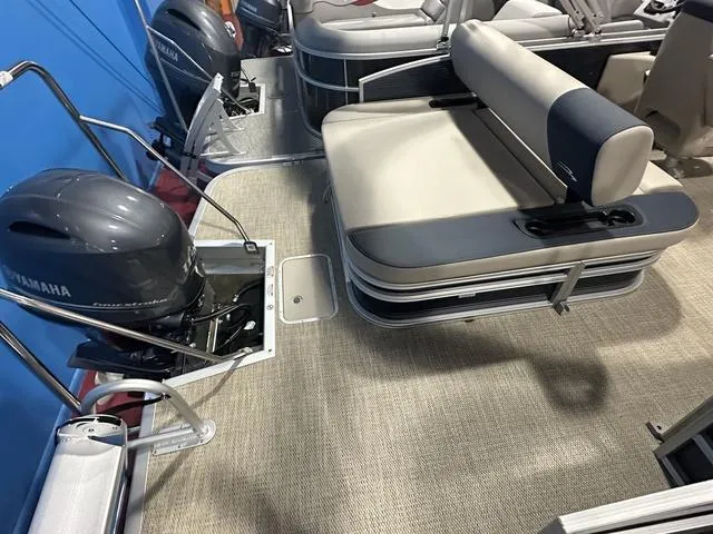 Slide: The Image of 2024 Bennington 22' SSB pontoon boat interior with Yamaha outboard motor and seating. - 11