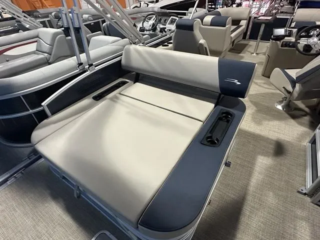Slide: The Image of 2024 Bennington 22' SSB boat interior with plush seating and cup holders. - 13
