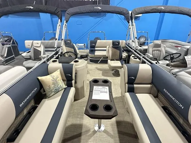 Slide: The Image of 2024 Bennington 22' SSB pontoon boat interior with plush seating and modern amenities. - 3