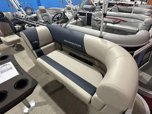 Slide: The Image of 2024 Bennington 22' SSB boat interior with plush seating and cup holders. - 5