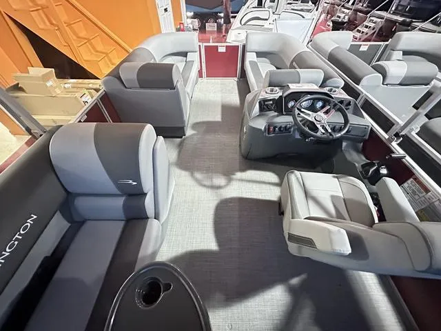Slide: The Image of 2024 Bennington 188 SVL pontoon boat interior with plush seating and modern helm. - 7