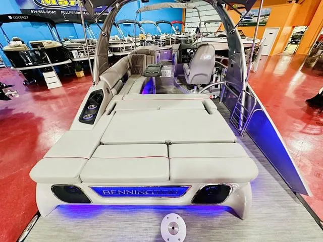 Slide: The Image of 2023 Bennington 25 RXSBA pontoon boat with luxurious seating and ambient lighting. - 20