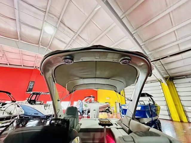 Slide: The Image of 2023 Bennington 25 RXSBA boat interior with canopy in showroom. - 21