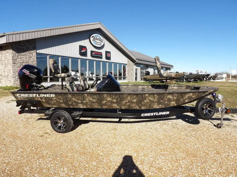 The Image of 2025 Crestliner XFC 189 boat on trailer outside dealership. - 1