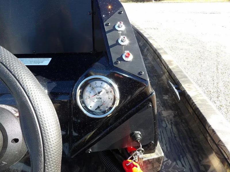 Slide: The Image of Dashboard of 2025 Crestliner XFC 189 boat with RPM gauge and controls. - 18