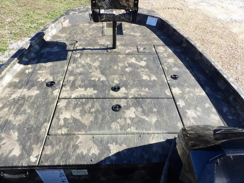 Slide: The Image of 2025 Crestliner XFC 189 boat deck with camouflage pattern, featuring storage compartments. - 22