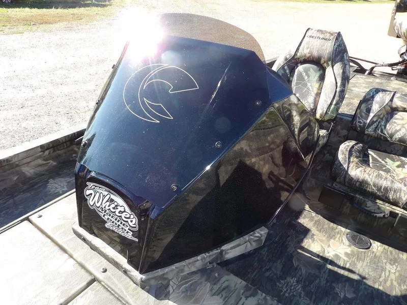 Slide: The Image of 2025 Crestliner XFC 189 boat console with camouflage seats and custom graphics. - 23