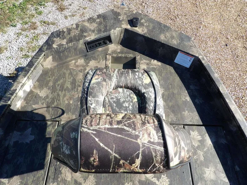 Slide: The Image of 2025 Crestliner XFC 189 boat with camouflage seating and deck, viewed from above. - 29