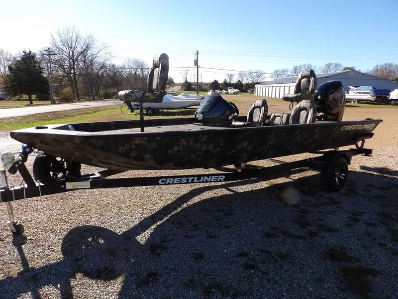 Slide: The Image of 2025 Crestliner XFC 189 fishing boat on trailer, parked outdoors on gravel. - 3
