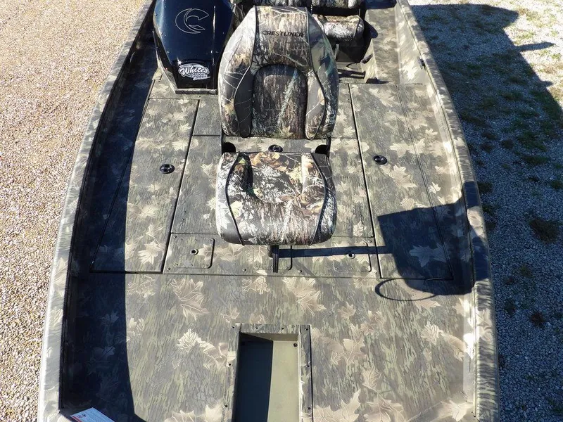 Slide: The Image of 2025 Crestliner XFC 189 boat with camouflage seating and deck design. - 30