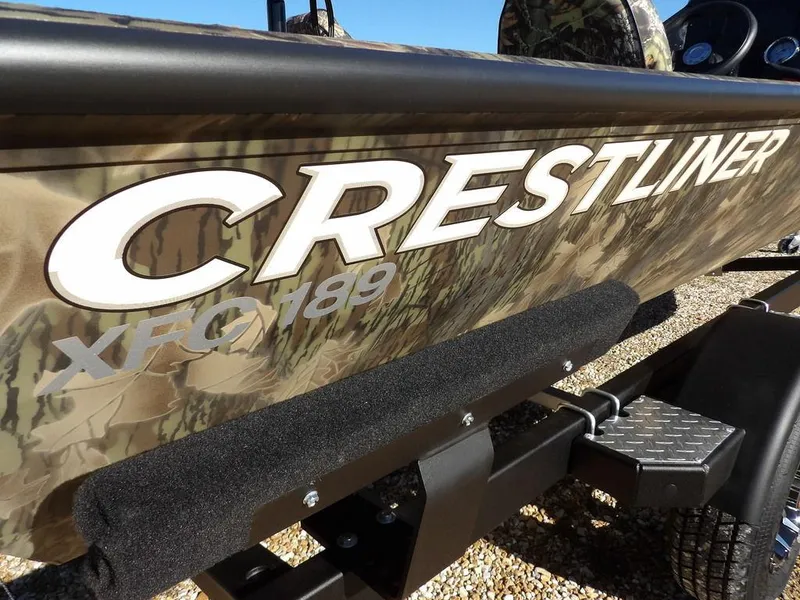 Slide: The Image of 2025 Crestliner XFC 189 boat with camouflage design on trailer. - 36