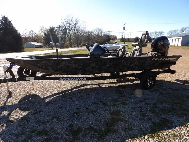 Slide: The Image of 2025 Crestliner XFC 189 fishing boat on trailer, parked outdoors. - 4