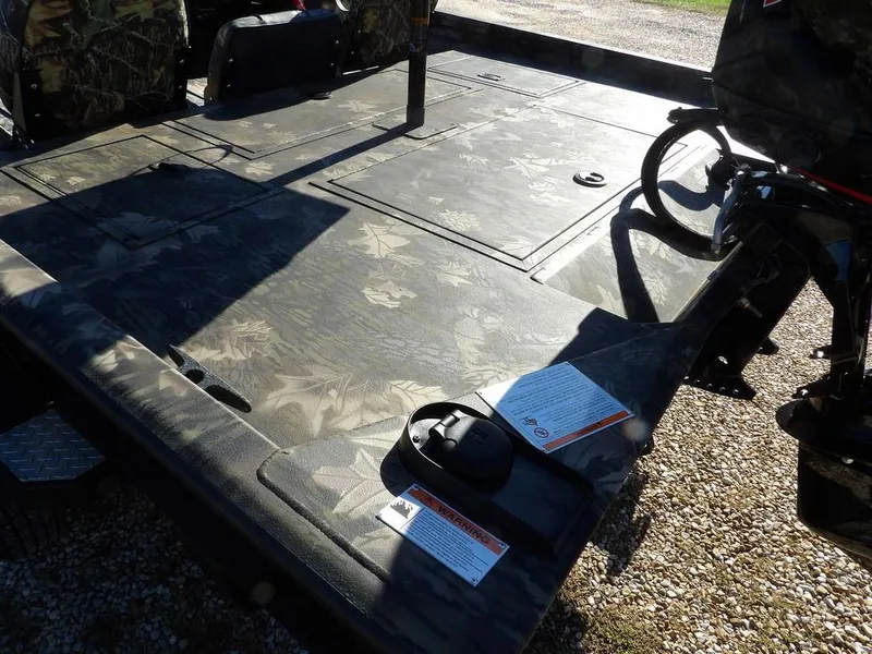 Slide: The Image of 2025 Crestliner XFC 189 boat deck with camouflage pattern and equipment. - 7