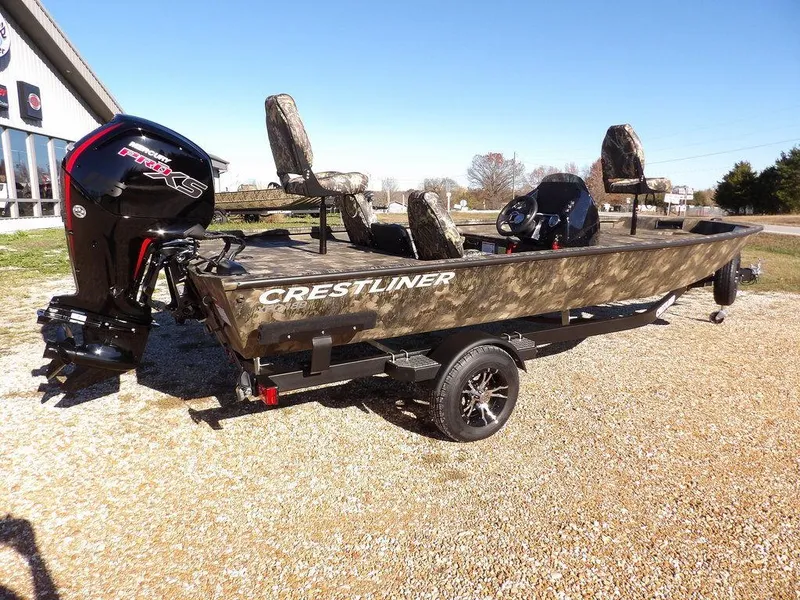 Slide: The Image of 2025 Crestliner XFC 189 fishing boat with camo design and powerful outboard motor. - 8