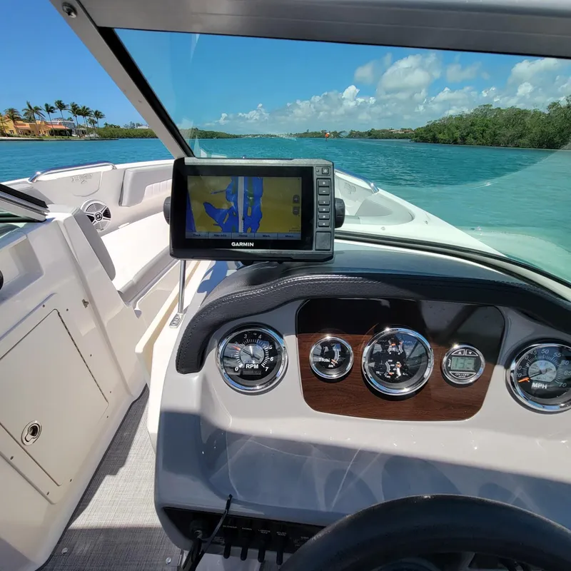 Slide: The Image of 2019 Chaparral 21 H2O Sport dashboard with Garmin GPS on a sunny day. - 3